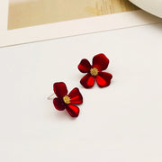 Buttercup flower stud earrings covered in 18k gold