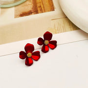 Buttercup flower stud earrings covered in 18k gold